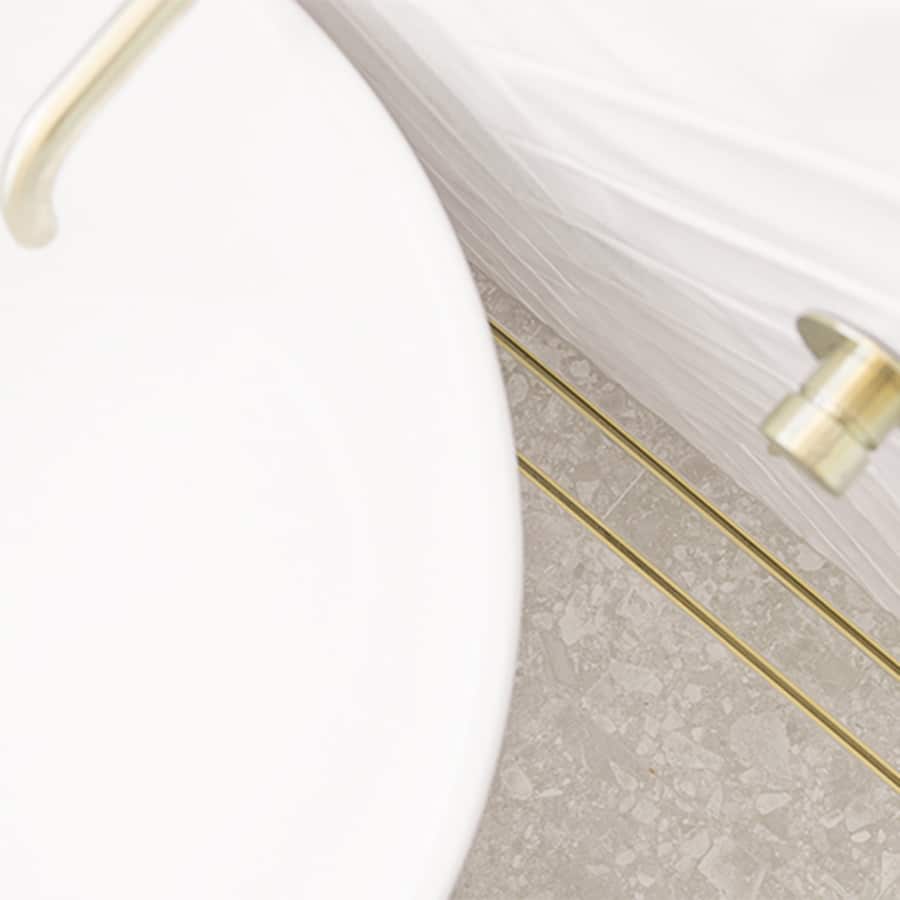 Gold Tile Insert Installed In Bathroom